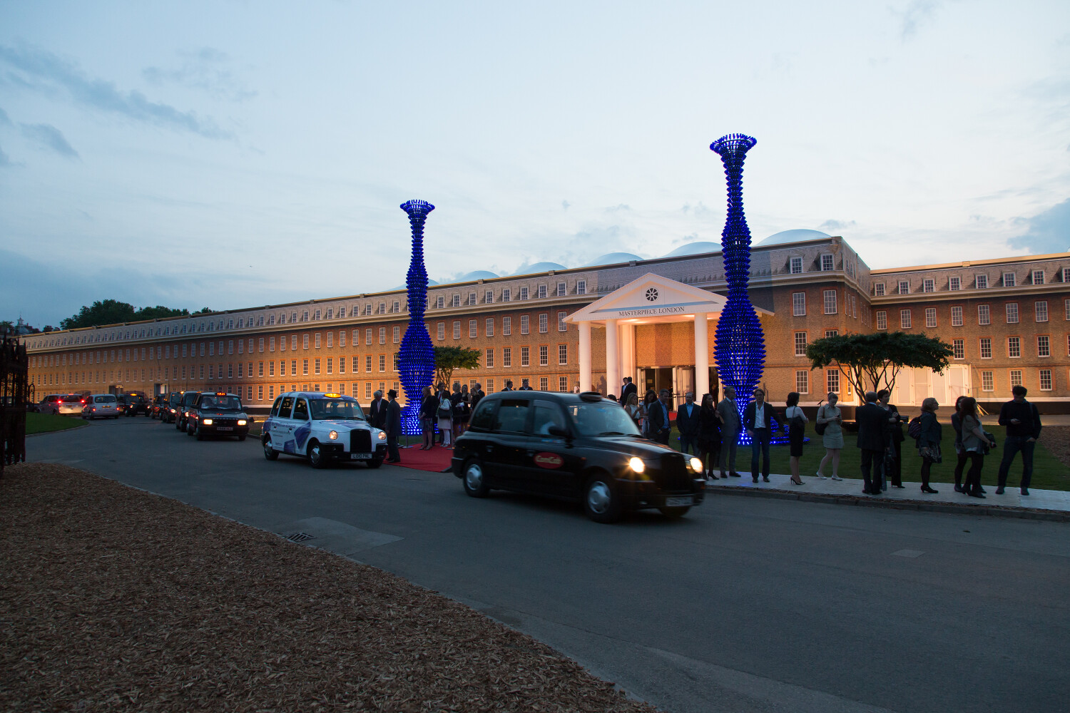 Sculpture WalkTaxis at the entrance of Masterpiece London.jpg